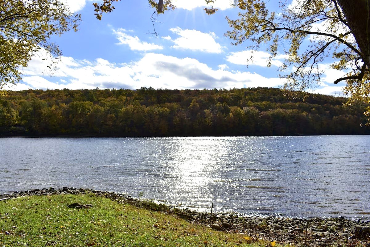Open water and a wooded far bank on an autumn afternoon, a mile from the inn